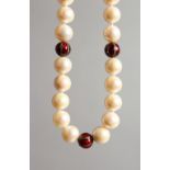 A PEARL NECKLACE with diamond and enamel sections.