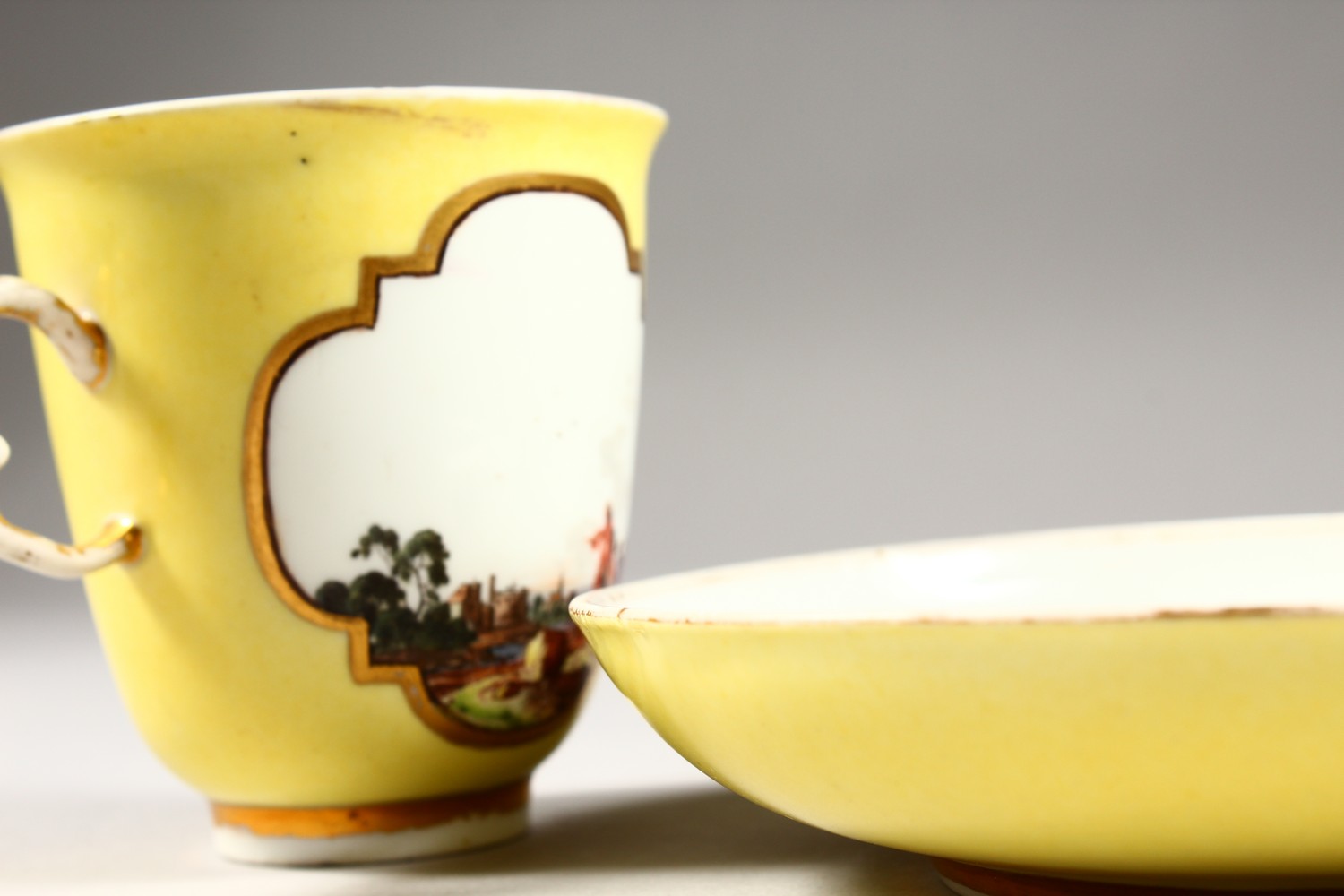 A SUPERB 18TH CENTURY MEISSEN CUP AND SAUCER, with yellow ground, the cup painted with two landscape - Image 10 of 13