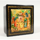 A RUSSIAN BLACK PAPIER MACHE SQUARE BOX, "Merrymaking". 4ins x 4ins.