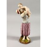 A 19TH CENTURY HOCHST POTTERY FIGURE OF A MOTHER HOLDING A BABY. Circular wheel mark and Incised