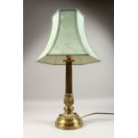 A GOOD EARLY 20TH CENTURY ORNATE BRASS TABLE LAMP with shade. Lamp 20ins high.