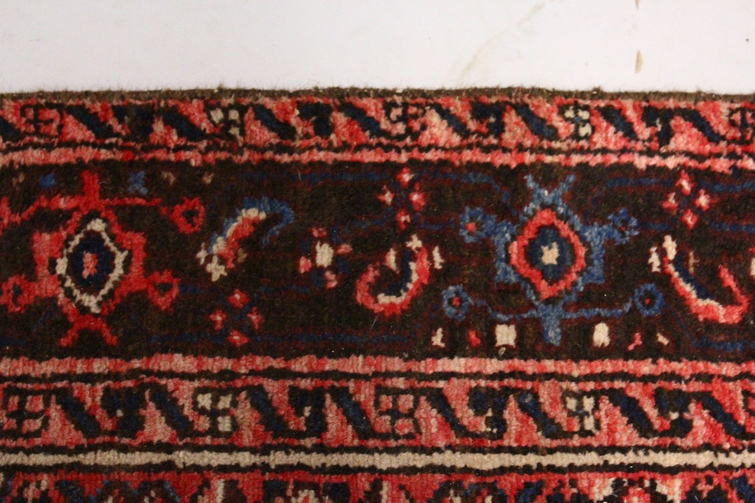 A PERSIAN RUG, 20TH CENTURY, red ground with central medallion, within a dark blue border. 6ft 10ins - Image 3 of 9