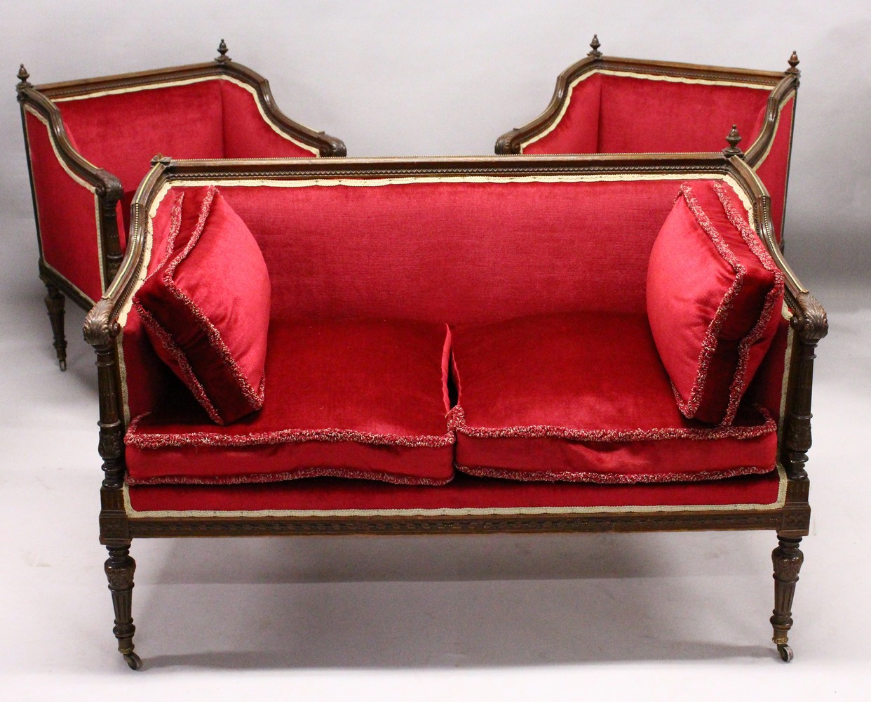 AN EDWARDIAN MAHOGANY THREE PIECE SUITE, comprising of a two-seater settee and pair of armchairs,