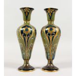 A SUPERB PAIR OF MOORCROFT FLORIAN WARE VASES, CIRCA. 1900. Monogrammed WM. Printed mark and