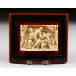 A 19TH CENTURY EUROPEAN CARVED IVORY EROTIC PLAQUE. 2.25ins x 3,25ins.