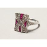 A SILVER ART DECO DESIGN FAUX RUBY RING.