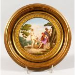 A VERY GOOD CONTINENTAL CIRCULAR PORCELAIN PLAQUE, depicting a classical scene with Paris. 7ins