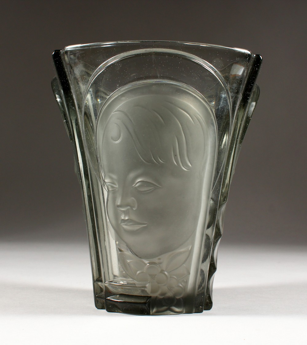 A glass vase, in the style of Lalique - with moulded decoration. 7.5ins high.