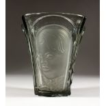 A glass vase, in the style of Lalique - with moulded decoration. 7.5ins high.