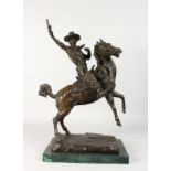 A GOOD MODERN BRONZE GROUP, of a cowboy on a rearing stallion, on a marble base. 21.5ins high.
