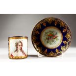 A FINE 19TH CENTURY SEVRES CUP AND SAUCER, rich blue ground painted with a portrait of Madam de