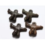 FOUR ROMAN BRONZE EROTIC PENDANTS.