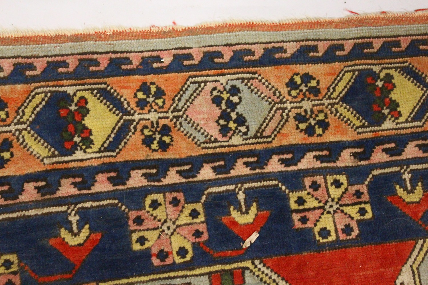 A PERSIAN RUG, 20TH CENTURY, bright red ground with large stylised design, within a similar double - Image 5 of 11