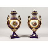 A SUPERB PAIR OF 19TH CENTURY SEVRES PORCELAIN URNS AND COVERS, rich blue and gilt ground, painted