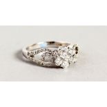 AN 18CT WHITE GOLD DIAMOND SET RING of 65 points.