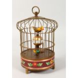 A NOVELTY BIRD CAGE TABLE CLOCK. 8ins high.