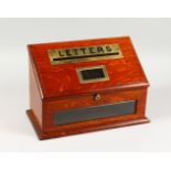 A GOOD EDWARDIAN OAK AND BRASS "LETTER" BOX, with sloping hinged top. 14.5ins wide x 10ins high.