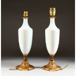 A PAIR OF 19TH CENTURY WHITE GLASS TABLE LAMPS. 15ins high.