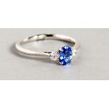 AN 18CT WHITE GOLD, SAPPHIRE AND DIAMOND THREE STONE RING.