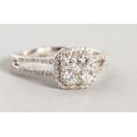 A GOOD 18CT WHITE GOLD DIAMOND AND CLUSTER DRESS RING.