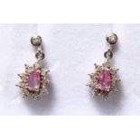 A PAIR OF 9CT GOLD, PINK SAPPHIRE AND DIAMOND DROP EARRINGS.