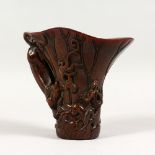 A CARVED HORN LIBATION CUP. 6ins high.