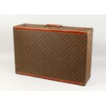 A GOOD LOUIS VUITTON SUITCASE with brass mounts. 2ft 4ins long x 1ft 6ins wide x 8.5ins deep.