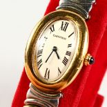 A CARTIER GOLD AND STEEL WRISTWATCH