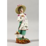 A 19TH CENTURY HOCHST POTTERY FIGURE OF A YOUNG GIRL, wearing a large hat, a tub of flowers by her