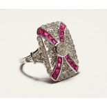 A SUPERB 18CT GOLD ART DECO DESIGN RUBY AND DIAMOND SET RING.