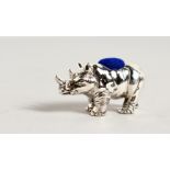 A NOVELTY SILVER RHINO PIN CUSHION. 1.25ins long.