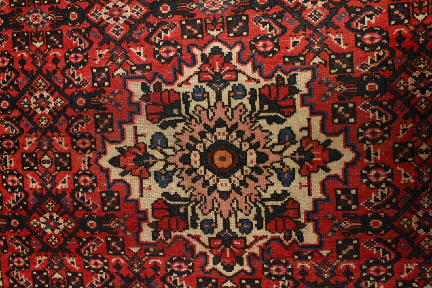 A PERSIAN RUG, 20TH CENTURY, red ground with central medallion, within a dark blue border. 6ft - Image 7 of 11