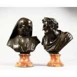 A SUPERB PAIR OF EARLY 19TH CENTURY ITALIAN BRONZE BUSTS OF ROMAN FIGURES, on veined marble plinths.