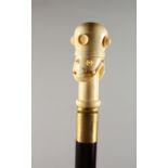 A BONE HANDLED WALKING STICK, carved as a divers helmet. 38ins long.