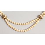 A DOUBLE ROW PEARL CHOKER, with two gold and pearl clasps