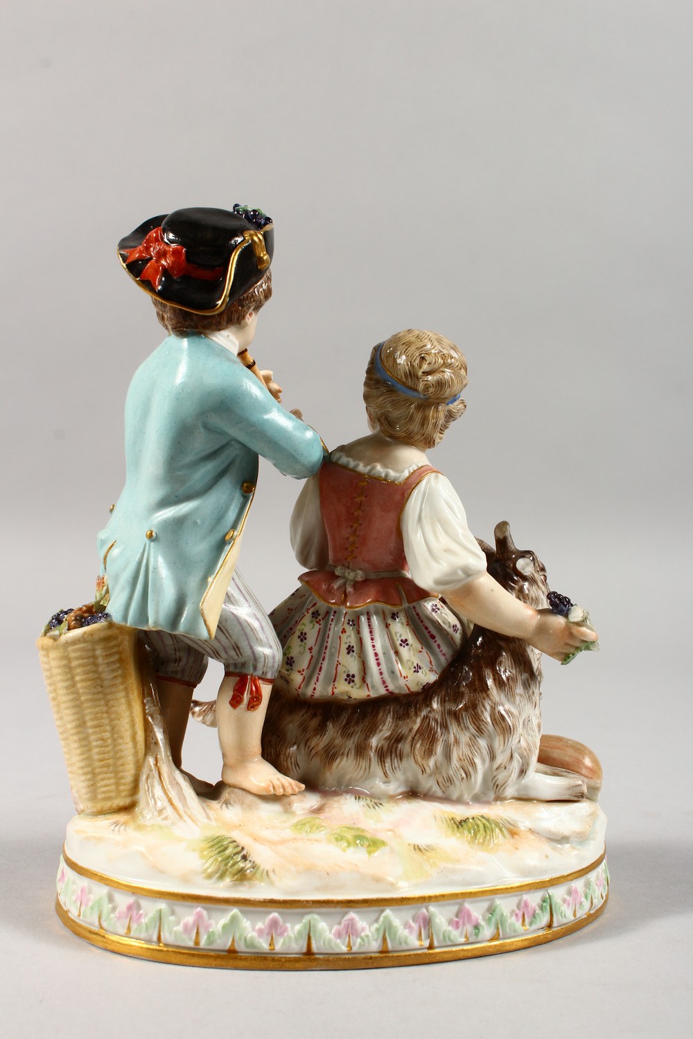 A 19TH CENTURY MEISSEN PORCELAIN GROUP OF A BOY AND GIRL, with goat and fruiting vines. Cross swords - Image 7 of 10
