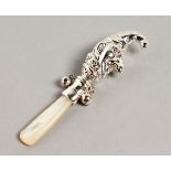 A NOVELTY SILVER AND MOTHER-OF-PEARL MR PUNCH BABIES RATTLE.