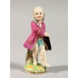 A SMALL 19TH CENTURY BERLIN PORCELAIN FIGURE OF A YOUNG BOY, with a tricorn hat. Mark in blue.