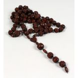 A ROSARY BEAD NECKLACE.