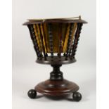 A DUTCH MAHOGANY JARDINIERE, with brass liner and turned spindle sides. 17ins high.