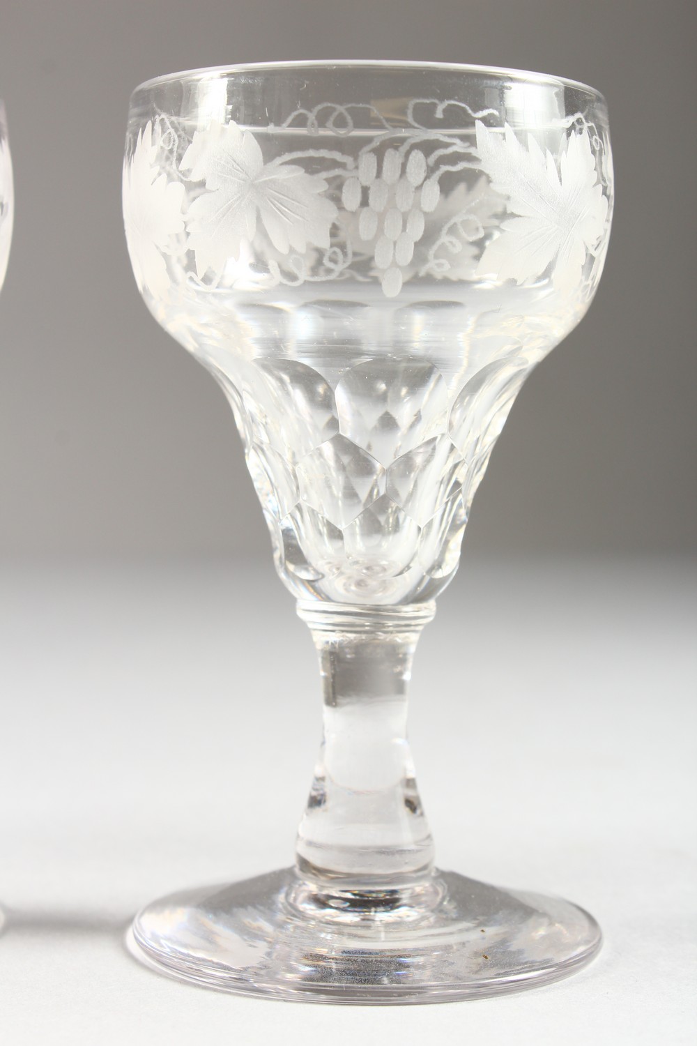 A SUITE OF GLASSWARE, etched with fruiting vines, comprising six large wine glasses and twelve other - Image 4 of 13