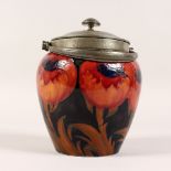 A GOOD MOORCROFT BIG POPPY BISCUIT JAR AND COVER with TUDRIC hammered pewter lid and handle.