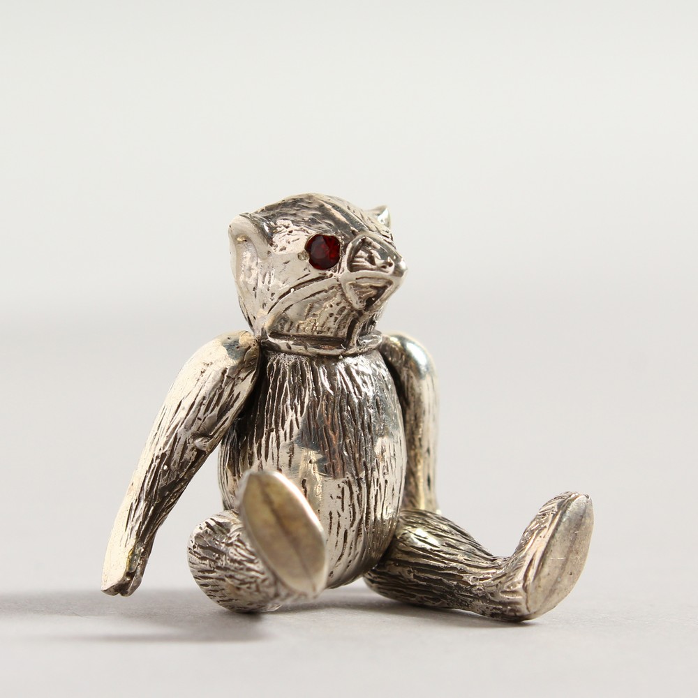 A NOVELTY SILVER TEDDY BEAR PIN CUSHION