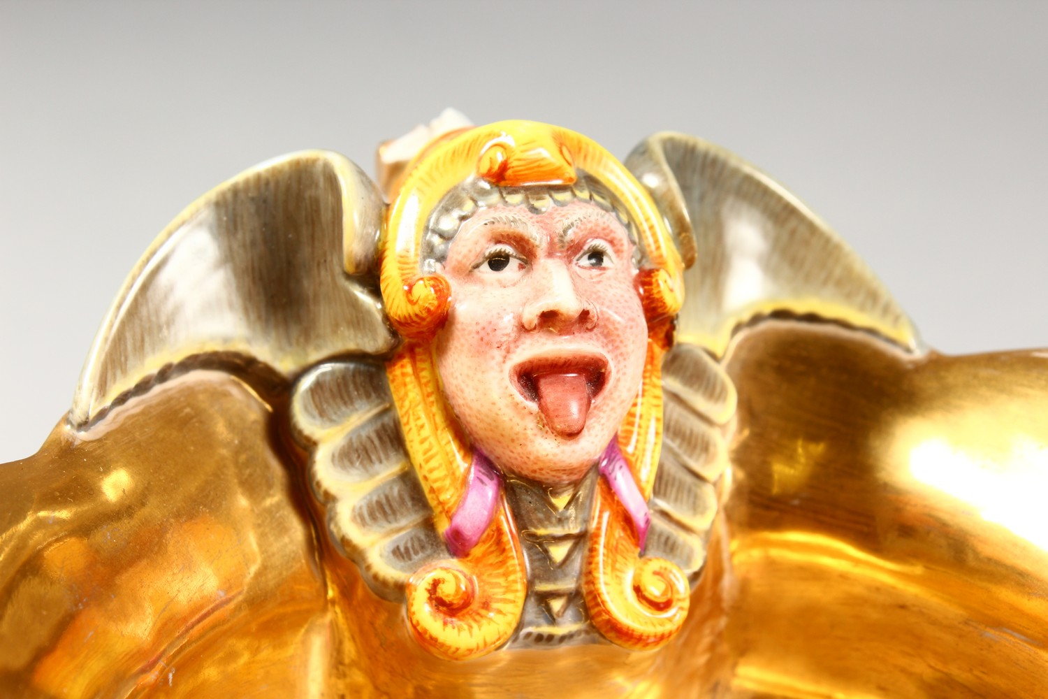 A BERLIN GILT PORCELAIN SAUCEBOAT, with grotesque mask, the centre painted with cupids. 8ins - Image 2 of 11