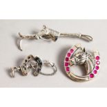 THREE NOVELTY SILVER HORSE AND HORSESHOE STICK PINS.