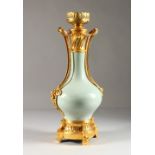 A 19TH CENTURY FRENCH CELADON AND ORMOLU LAMP VASE. 17ins high.