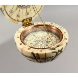 A GOOD ETCHED BONE BALL COMPASS. 2.5ins diameter.