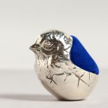 A NOVELTY SILVER CHICK PIN CUSHION.