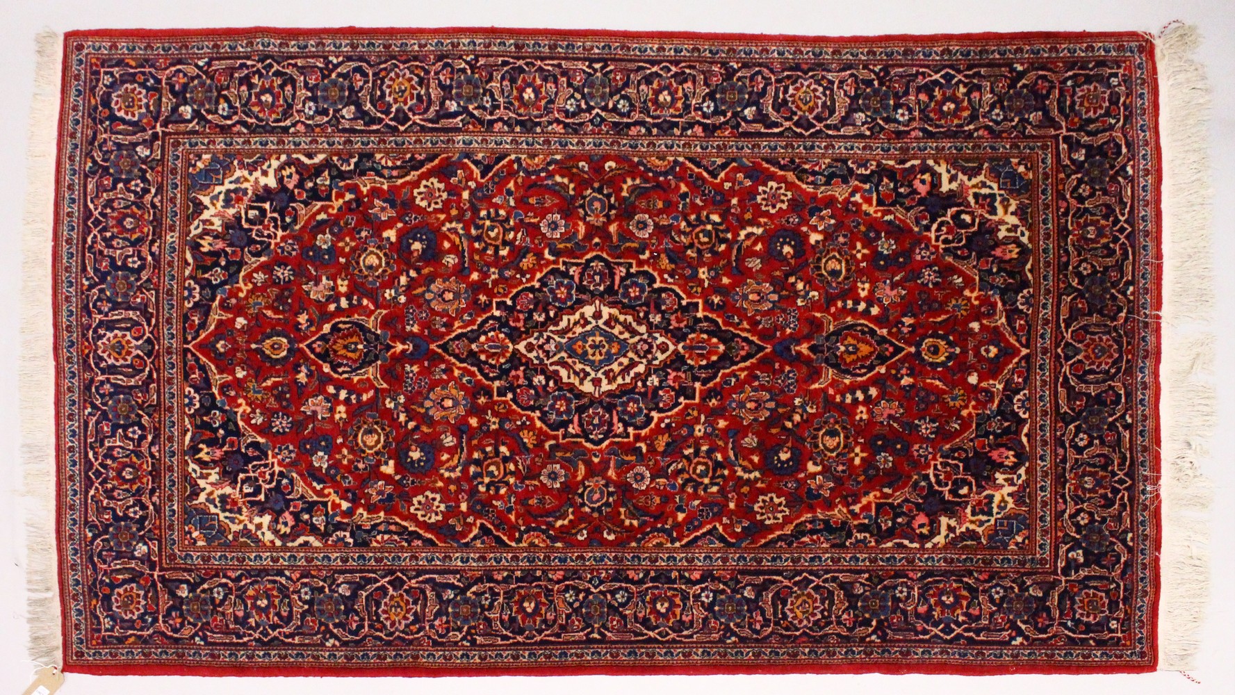 A GOOD KASHAN RUG, first half of 20th Century, red ground with all-over stylised floral