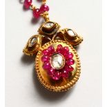 A GOOD 18CT GOLD, VICTORIAN RUBY AND DIAMOND PENDANT in a box.